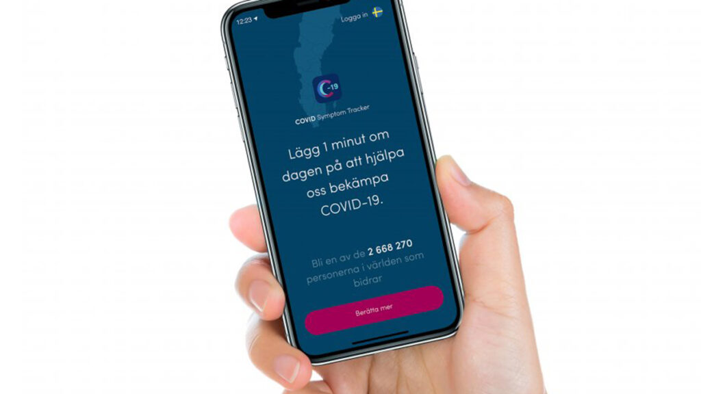Bild en hand som håller en mobil. På mobilen visas appen Covid Symptom Study.