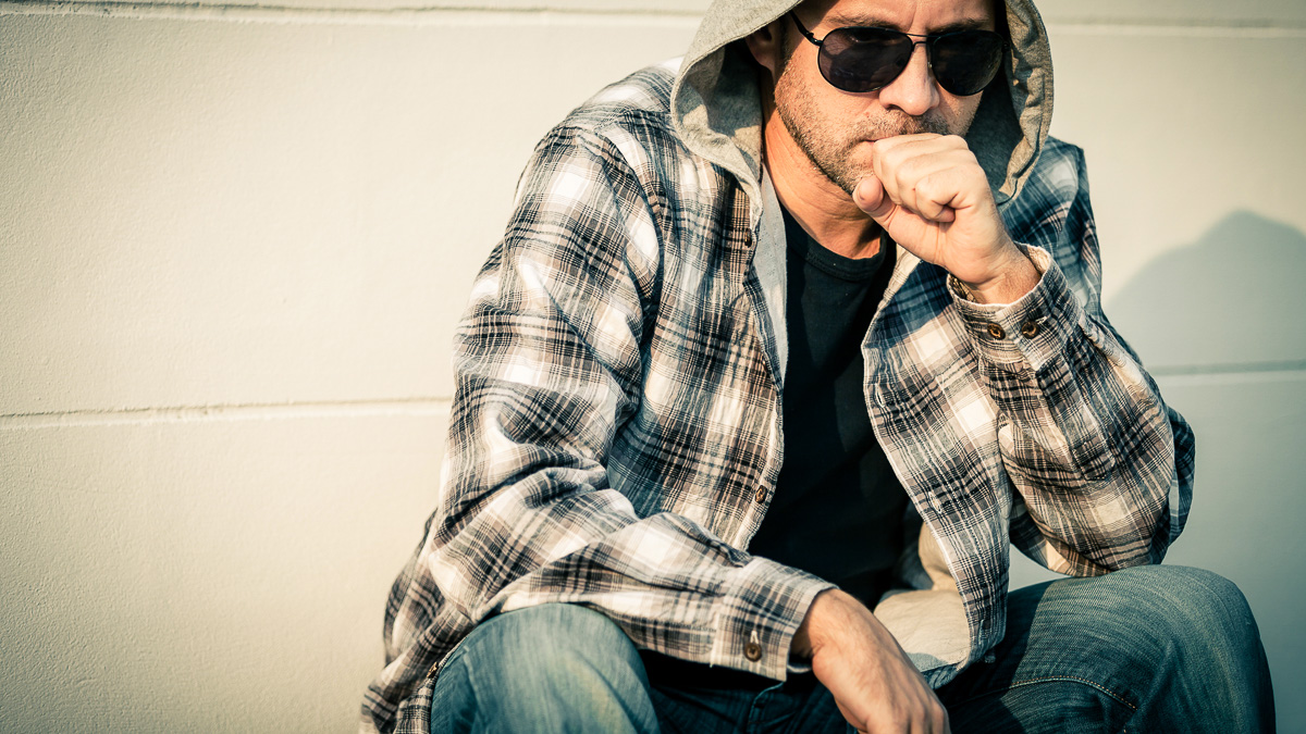 Portrait of a sitting man with sunglasses