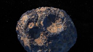 Potatisformad metallisk asteroid med ytan täckt av kratrar.