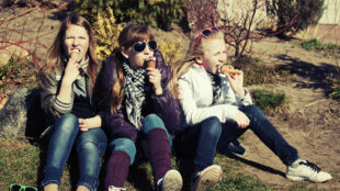 Teenage girls eating an ice cream